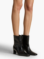 Khaite | Ona Ankle Boot in Black Glazed Leather | The UNDONE