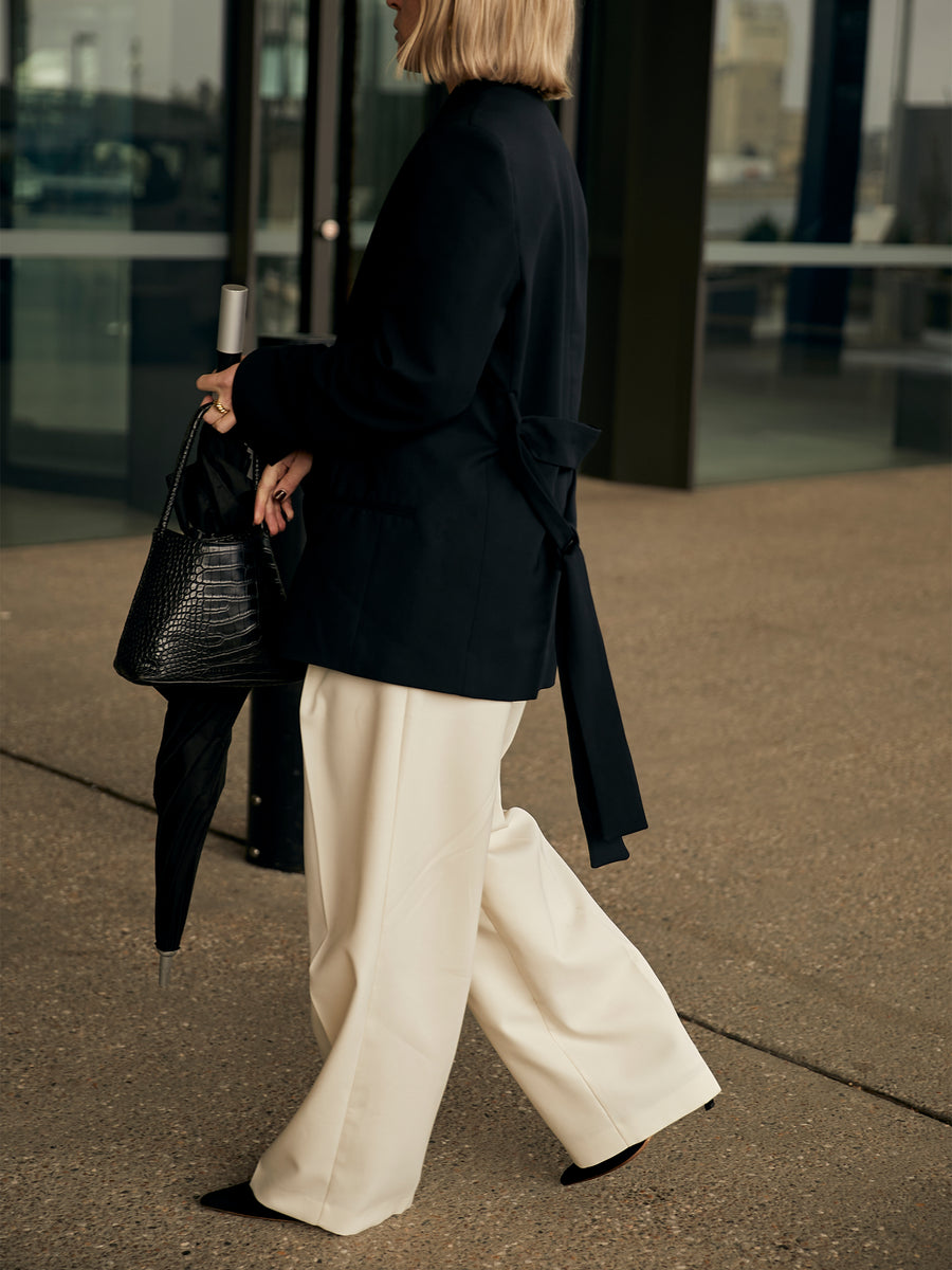 The_UNDONE_Personal_Style_fashion_week_black_jacket_and_cream_pants