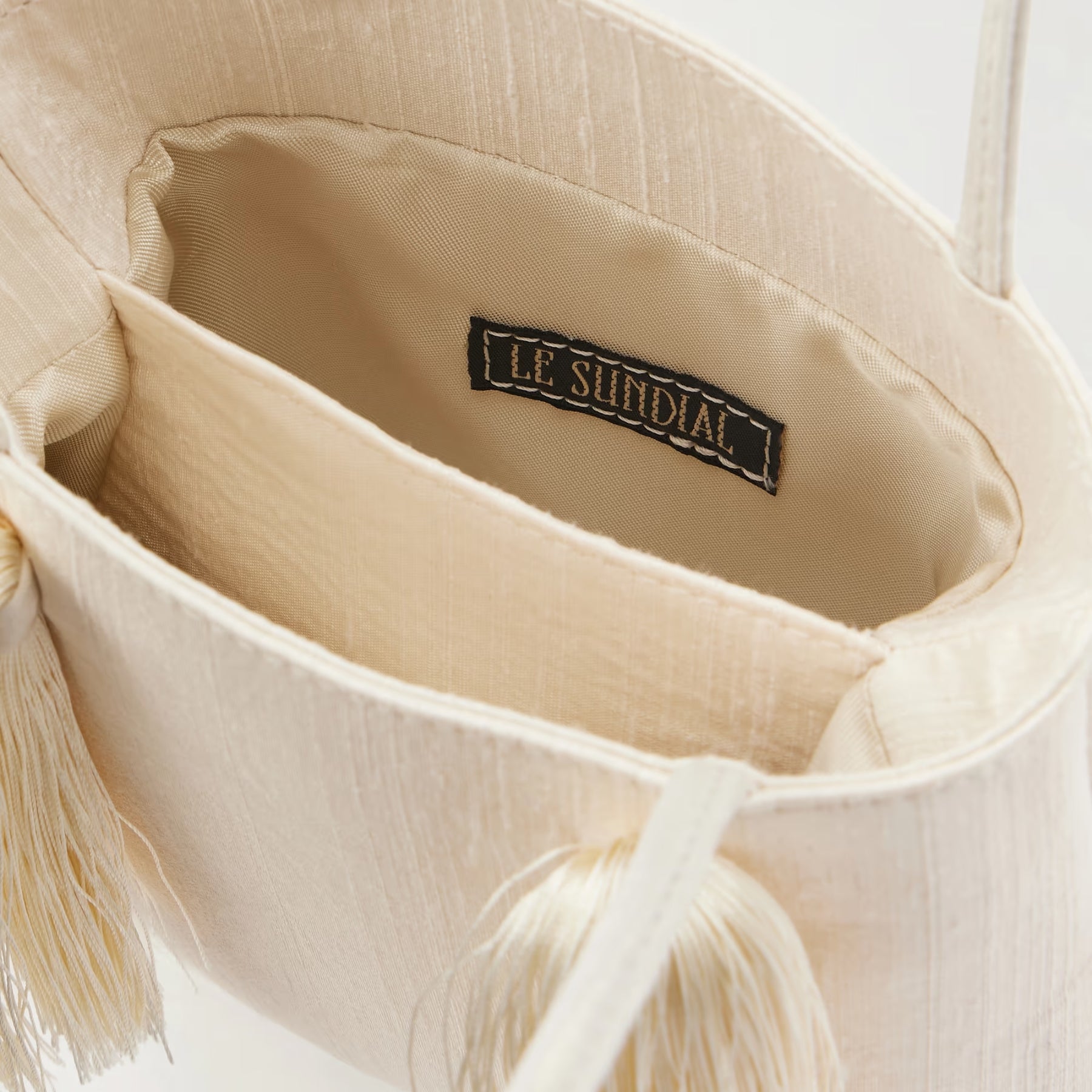 Le Sundial | Le Salon Ivory tasseled dupioni clutch