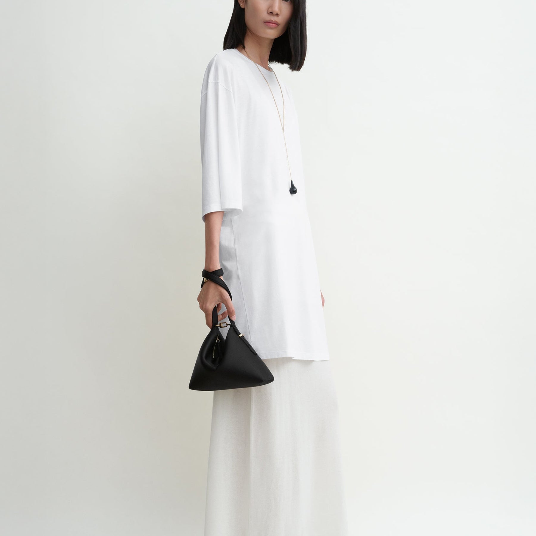 TOTEME | Bevel Satin Wristlet in Black | The UNDONE