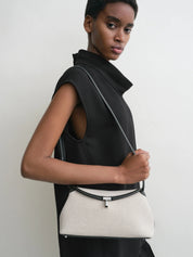 T-Lock canvas clutch in Ecru and Black | Toteme