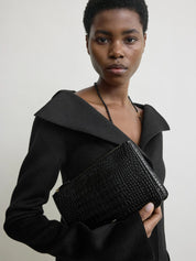 Toteme Threefold croco-embossed clutch black | The UNDONE